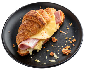 ham and cheese croissant on black plate