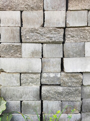 Stacked cement road curbs, broken and intact