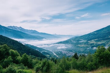 Fototapeta premium Scenic mountain landscape with lush green forests and misty valley, showcasing natural beauty and tranquility in a serene outdoor environment