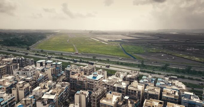 Aerial view of Navi Mumbai near Navi Mumbai International Airport, showing modern roads, scenic surroundings, and urban infrastructure. Ideal for smart city and development themes. 