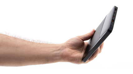 Holding a sleek portable charger for devices