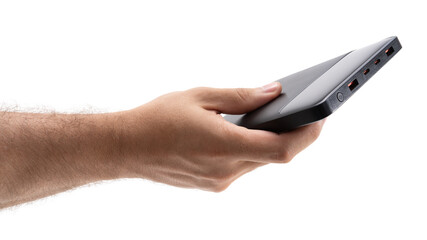 Hand holding a portable power bank for charging