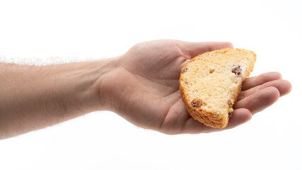 Hand holding a piece of freshly baked cookie