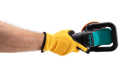 Hand holding garden trimmer in daylight
