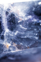 Beautiful close up of quartz crystal rock shard with reflective rainbow spiritual light