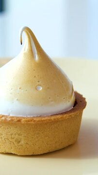 Lemon tart sweet dessert meringue, lemon curd pastry tasty fresh delicious gourmet food background table rustic food top view copy space. High quality 4k footage