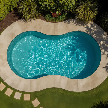 Overhead View of Kidney-Shaped Swimming Pool with Landscaping
