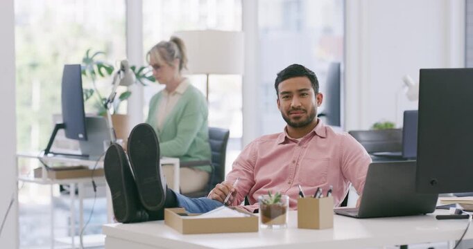 Business, man and relax with computer in office with playful expression, flirt personality and flattery. Male person, wink gesture and charm colleague on work break, employee secret and feet on table