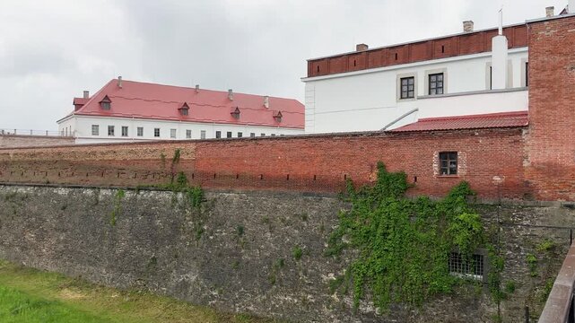 Gate, walls with moat, bastion of medieval Dubno Castle, Ukraine