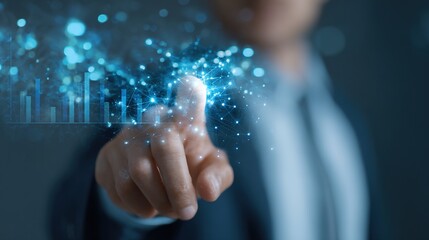 Digital Interaction: A person's finger points to a glowing point of light, representing the forefront of future technology, illustrating digital innovation and data analytics. 