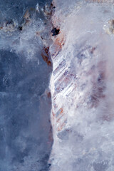 Beautiful close up of quartz crystal rock shard with reflective rainbow spiritual light