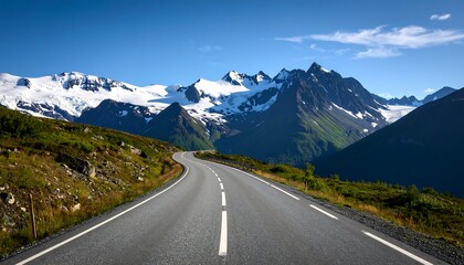Naklejka premium Picturesque mountain road under a clear blue sky offering scenic driving adventure