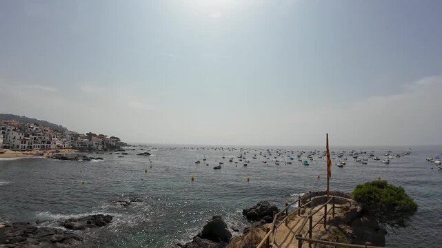 Calella de palafrugell coastline showing boats and rocks