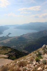 View of the runway of the Tivat airport from the top of the mountain. View of the Bay of Kotor in Montenegro