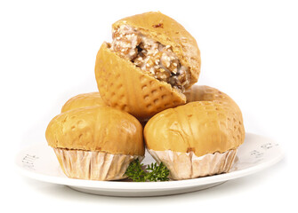 Canton style walnut buns wrapped in brown sugar syrup on white plate