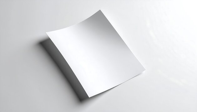 Minimalist composition of a blank white paper mockup with soft shadows, ideal for business or graphic design.