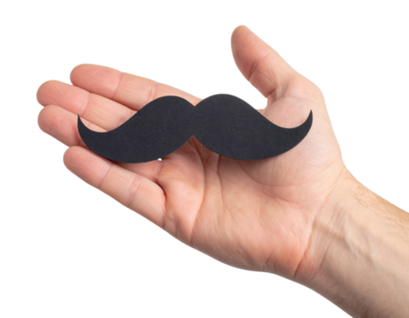 A hand holds a black mustache cutout against a black background, symbolizing humor, fashion, or playful expression.