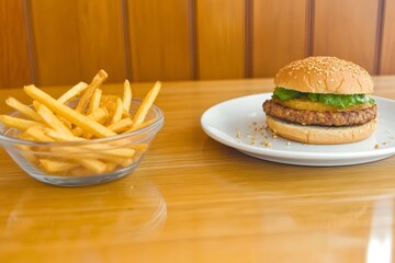 Sandwich with fries on clean plate, with empty left side for putting a slogan or message