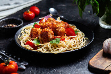 Spaghetti and Meatballs Dish with Fresh Tomatoes and Basil