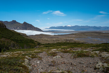 Expansive Glacier Landscape in Mountainous Terrain Under Clear Blue Sky