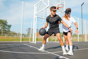 Engaging basketball practice between two dedicated players outdoors