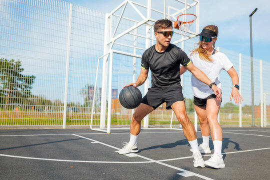 Engaging basketball practice between two dedicated players outdoors