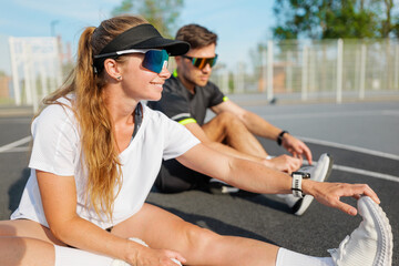 Stretching and warming up on the court before an exciting match