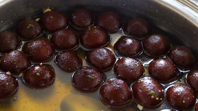 Gulab jamun or kala jaam an indian fried dessert dipped in sugar syrup