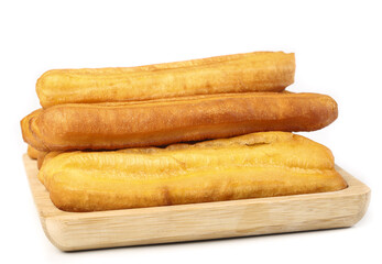 Crispy golden fries served on a wooden platter for a delightful breakfast experience