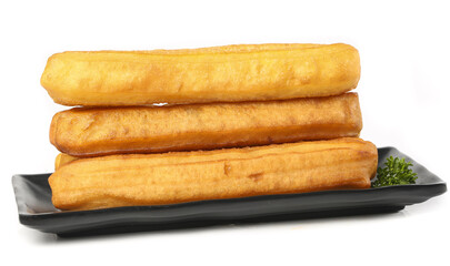 Crispy fried fritters served on a black platter make for a delicious gourmet breakfast option