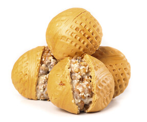 Closeup of freshly baked brown sugar walnut buns arranged on a white background for an appetizing display