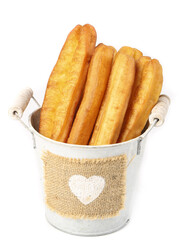 Crispy fritters served in a rustic bucket for a delightful traditional breakfast experience
