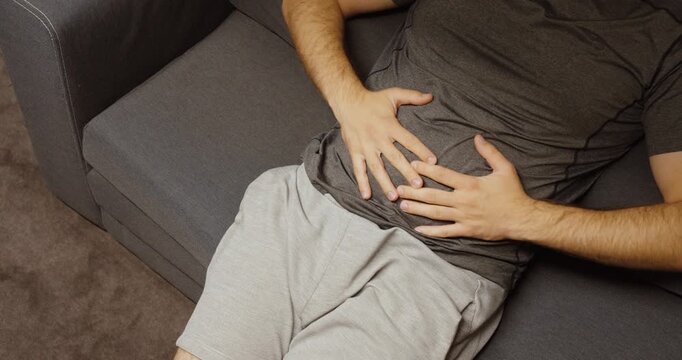 Concept of Bloating, Fullness, Digestion Issues or Abdominal Discomfort in Casual Home Setting