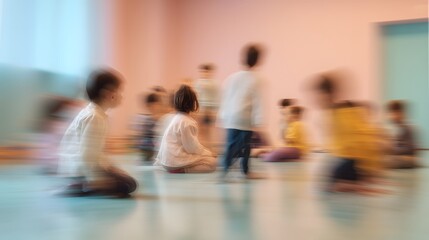 Fototapeta premium Blurry Motion Of Children Sitting And Playing On A Light Blue And Pink Floor