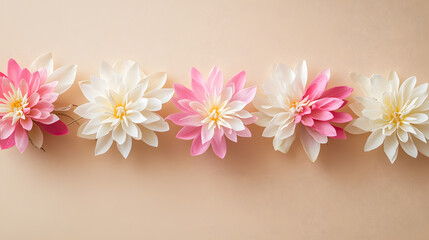 Pink and white lotus flower garland with soft petals arranged on beige background, creating peaceful and elegant atmosphere
