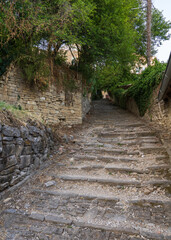 Medieval stone street in Motovun, Istria region of Croatia. Picturesque European townscape with historic charm, ideal for travel, tourism, architecture concepts.