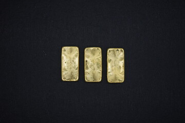 Gold bars, gold color, containing 96.5 percent gold.