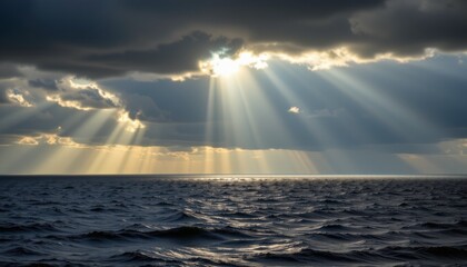 Powerful sun rays breaking through clouds over tranquil ocean waves scenic nature landscape dramatic atmosphere coastal view