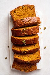 Moist pumpkin bread sliced and aligned neatly for an elegant fall vibe.
