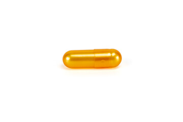 Golden oil supplement pill, a fish oil, omega-3, or vitamin E capsule for health and nutrition. Isolated on white background with clipping path.