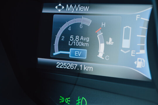 Dashboard of a hybrid car with battery charge level and electric drive indicator