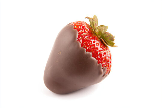a chocolate covered strawberry with a bite taken out of it