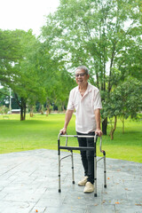 Happy Asian Senior Couple Relaxing Together in Park with Wheelchair