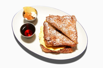 French-Toast-Egg-Sandwich-with-Syrup-on-white-plate-silohoutte-background