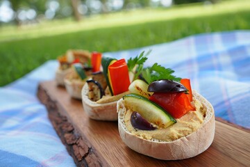 Delicious Vegan Appetizers on Wooden Board Perfect for Picnic Summer Celebration Healthy and Colorful Bruschetta Outdoors