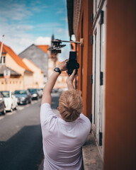 young man taking a picture with a camera