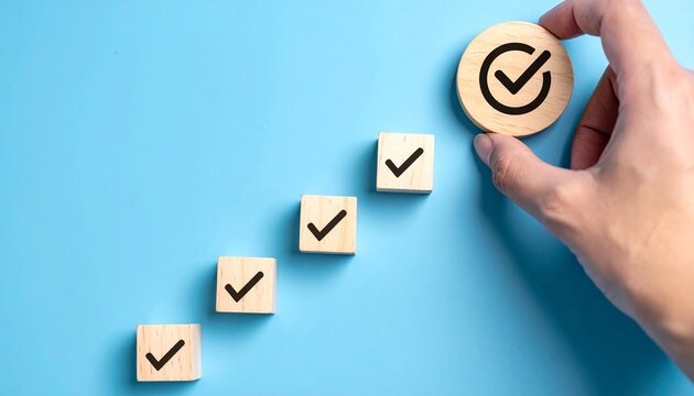 Hand placing final large check marked block in diagonal sequence, symbolizing milestone completion