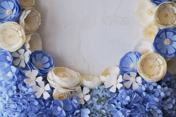 Blue and white paper flowers create a beautiful floral arrangement against a textured backdrop
