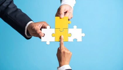 Hands connecting yellow puzzle piece to white ones on blue background—symbol of teamwork and problem-solving