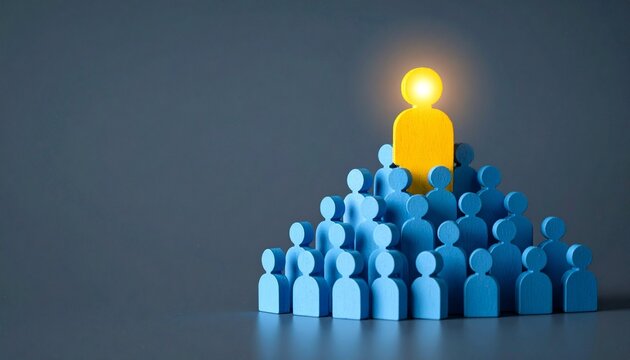Illuminated yellow figure atop a pyramid of blue figures symbolizing leadership and individuality